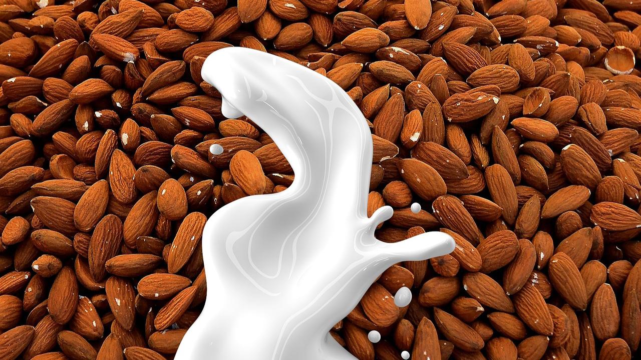 almonds with milk splashing over them