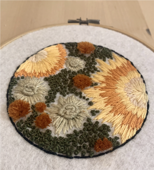 Embroidery on felt of a forgotten petri dish