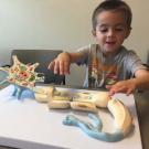 Child playing with neuron model