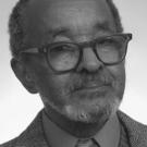 Black-and-white photograph of Dr. Emmett Chappelle, wearing a suit and tie.